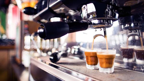 Cafe coffee machine in action making espresso. Penalty rates for Sunday workers have been upheld by the Federal Court.