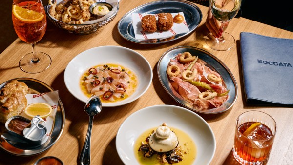 A range of dishes on a table featuring cheese, meets and deep fried items at Boccata Melbourne.