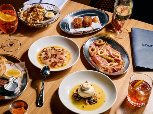 A range of dishes on a table featuring cheese, meets and deep fried items at Boccata Melbourne.