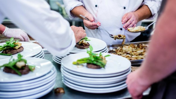 Chefs in the industry most at risk of failure serve food onto stacks of white ceramic plates. Image by Rene Terp.