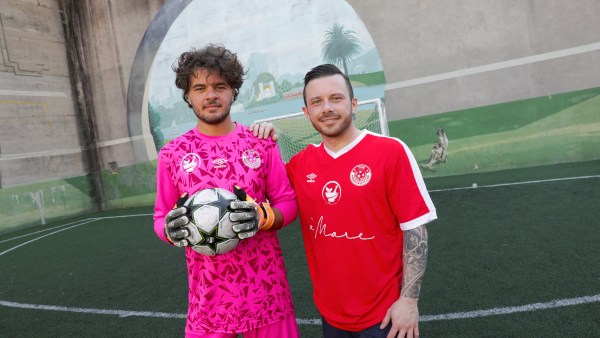 Fransesco and Gianluca Esposito wear pink and red Team a'Mare football jerseys for The Hospitality Cup Sydney