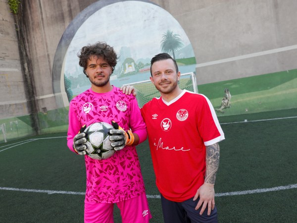 Fransesco and Gianluca Esposito wear pink and red Team a'Mare football jerseys for The Hospitality Cup Sydney