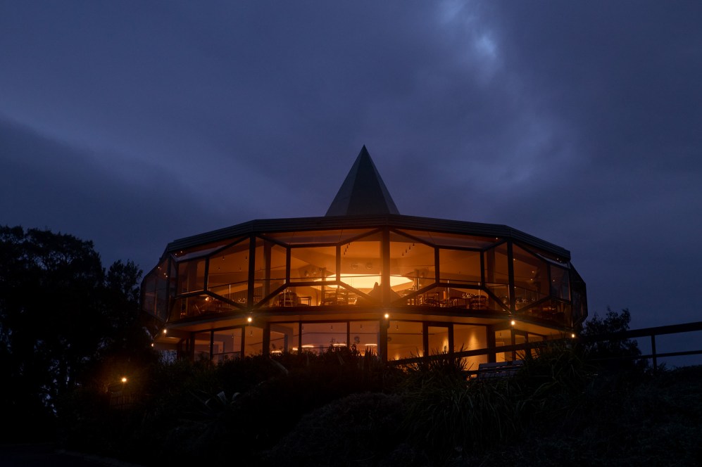 Exterior of the dodecagon Lunetta building at dusk.