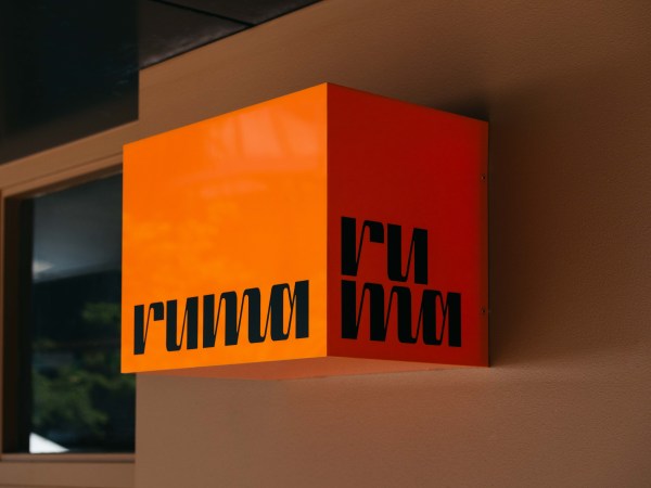 The orange and black box-shaped sign for Ruma in Double Bay