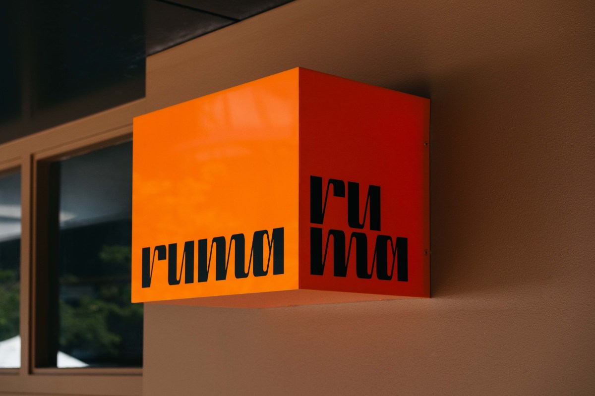 The orange and black box-shaped sign for Ruma in Double Bay